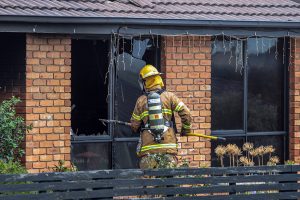 Neighbours brave flames to rescue home owner