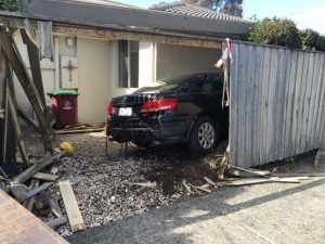 Driving mishap sends car through fence