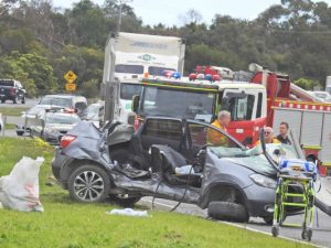 Crash traps woman in car