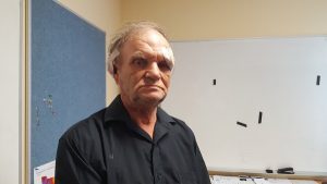 Stabbed with pitchfork, Rick tells intruders where to stick it