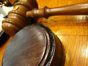 Two behind bars for hammer blow