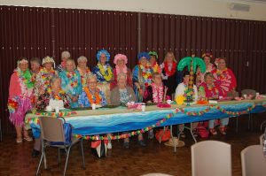 Hula time with Hawaiian flower backdrop