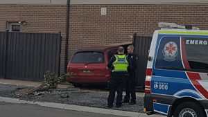 Car slams into house