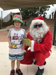 Santa comes to town in a fire truck
