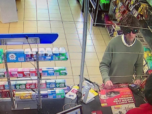Wig-wearing bandit steals fuel