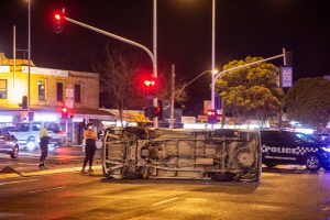 Woman injured after car rolls