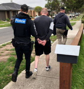 Sword and cash found in police raid