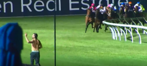 ‘Idiots’ run onto track