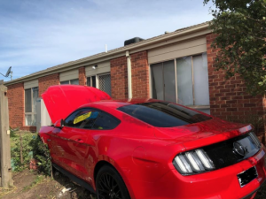 Car slams through fence, teen charged