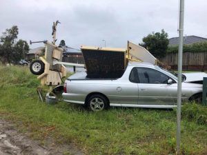 Car crushed by sign