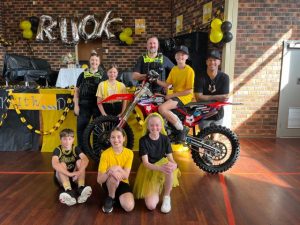 Motocross star inspires pupils to check in